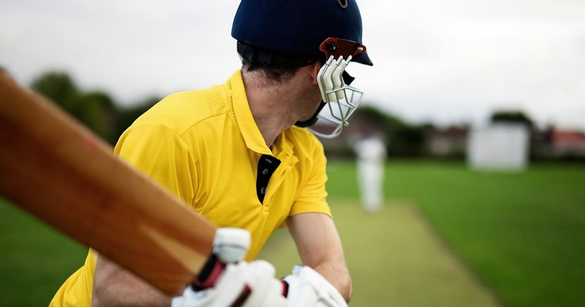 MS Dhoni walking into stadium lights in CSK yellow jersey concept