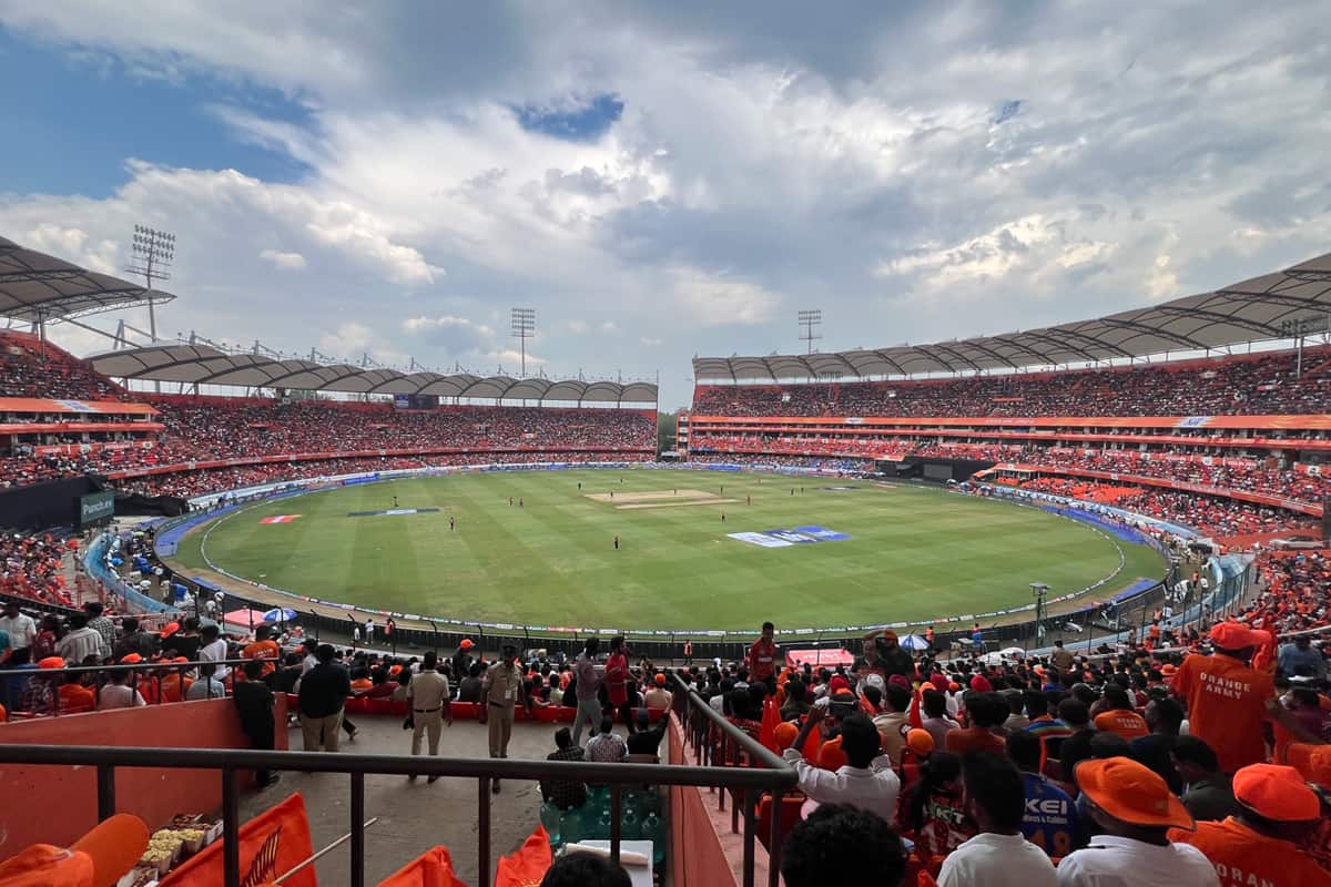 Night view of Rajiv Gandhi International Cricket Stadium Uppal packed with 55,000 fans during an IPL 2026 match.